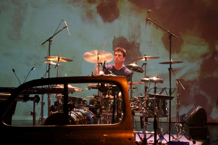 Steve Joslin in silhouette at an electronic percussion rig
