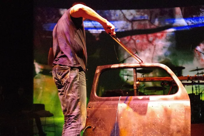 Steve Joslin performing with a full percussion setup